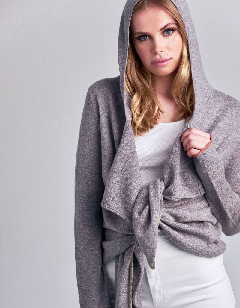 Studio photo of model in designer knitwear, the malin darlin cashmere tie hoody.