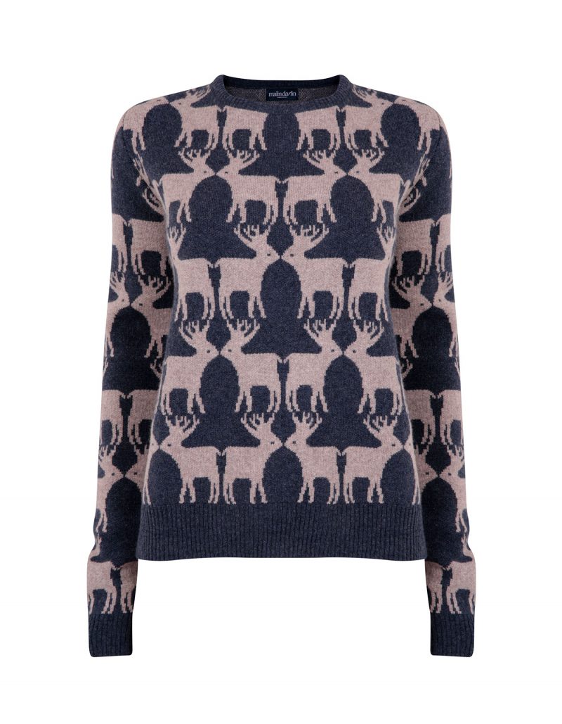 Image of a cashmere jumper with navy reindeers knitted into the design.