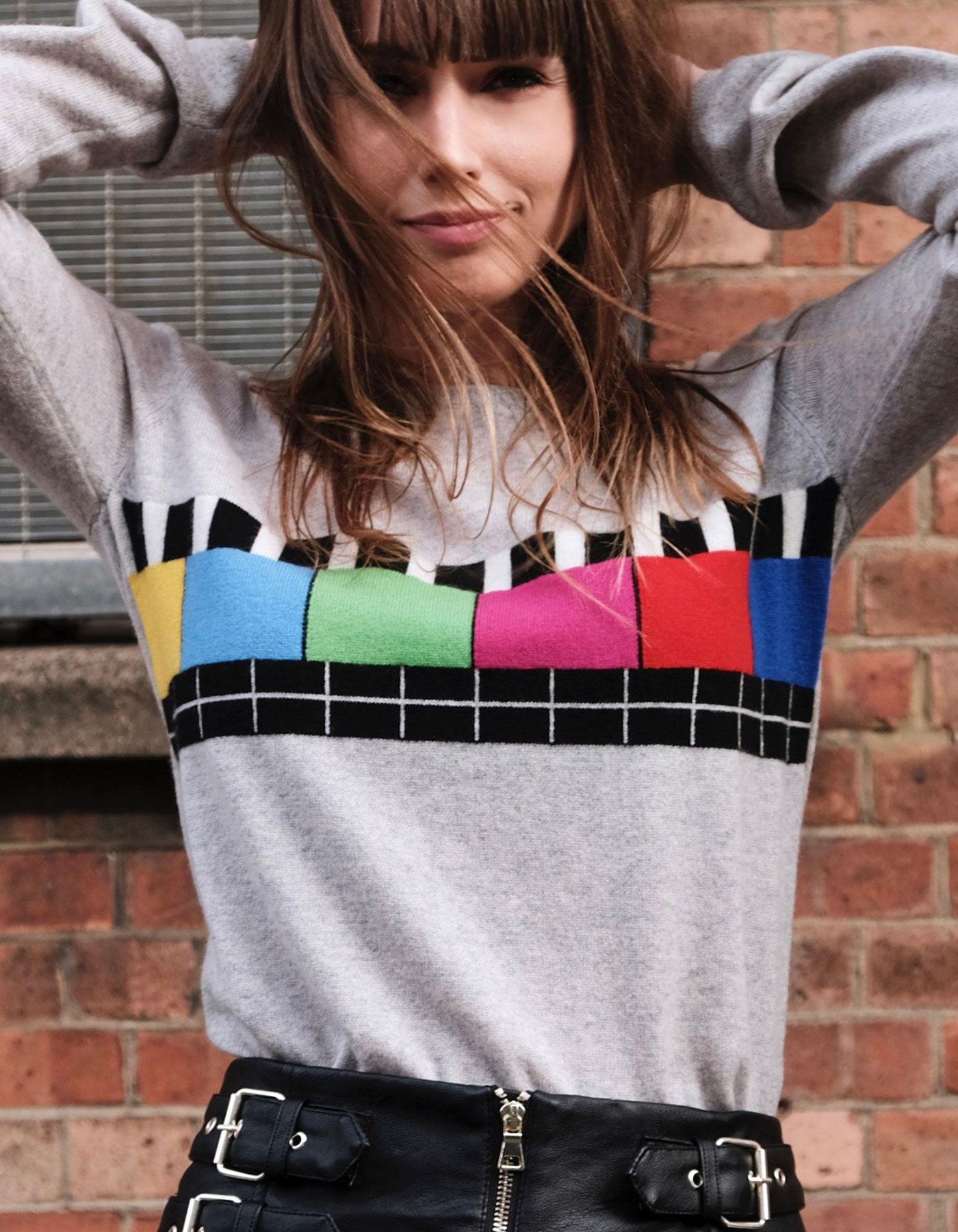 The Malin Darlin Test Bild marl cashmere jumper with multicolour pattern on the front.