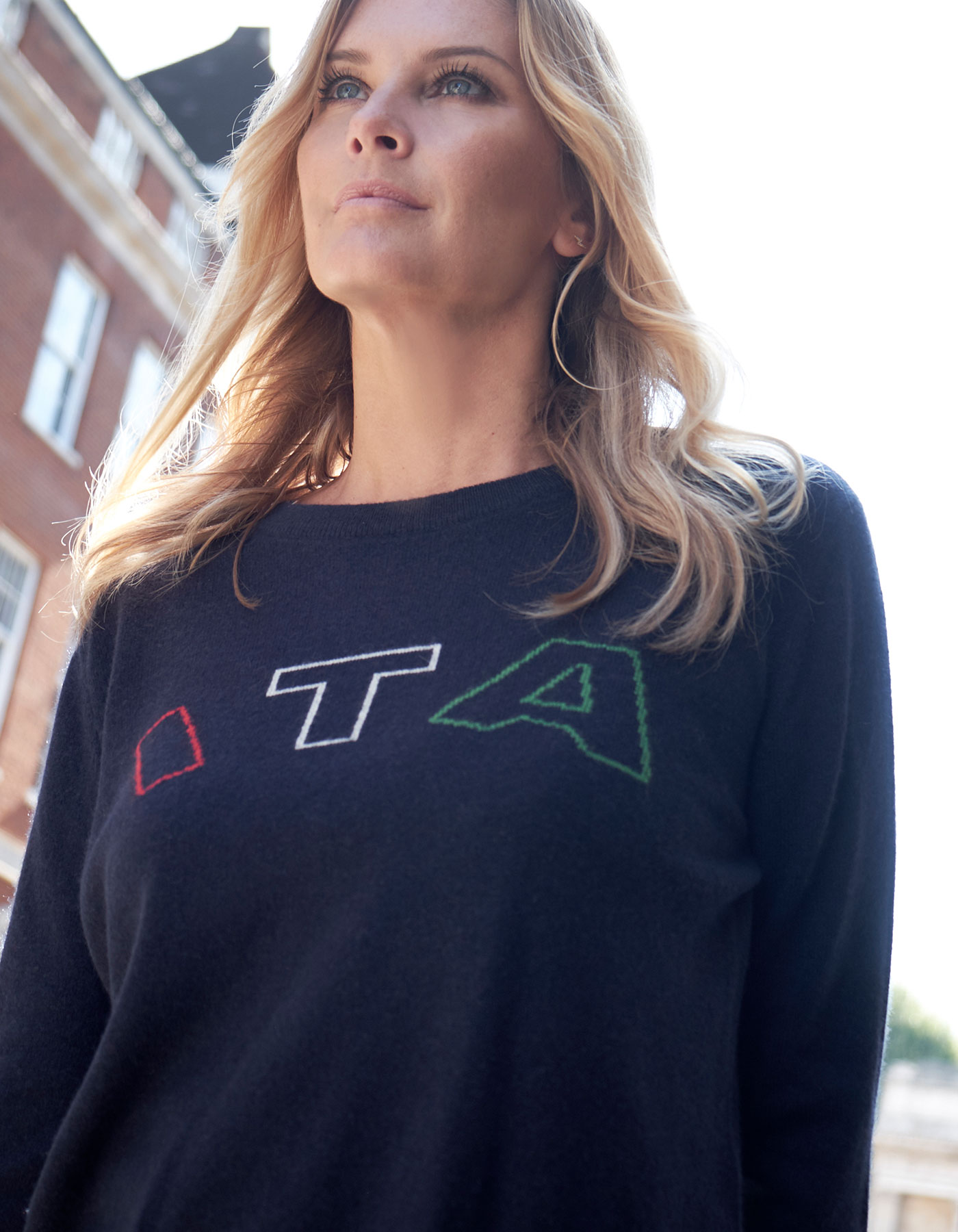 Close up of a woman in cashmere Knitwear, the malin darlin ITA designer cashmere jumper.