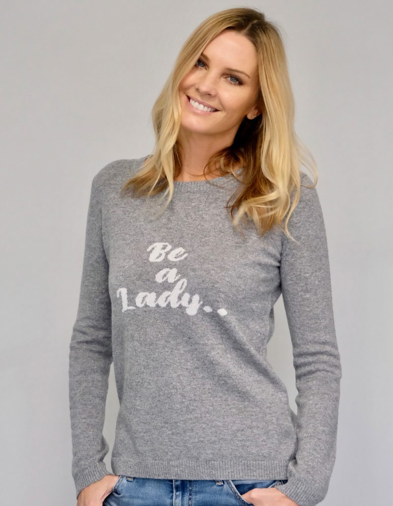 A woman wearing a malin darlin Be a Lady Limestone designer cashmere jumper.